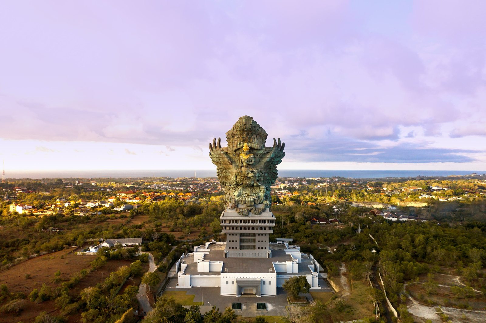 Monumental statue rising above the southern hills