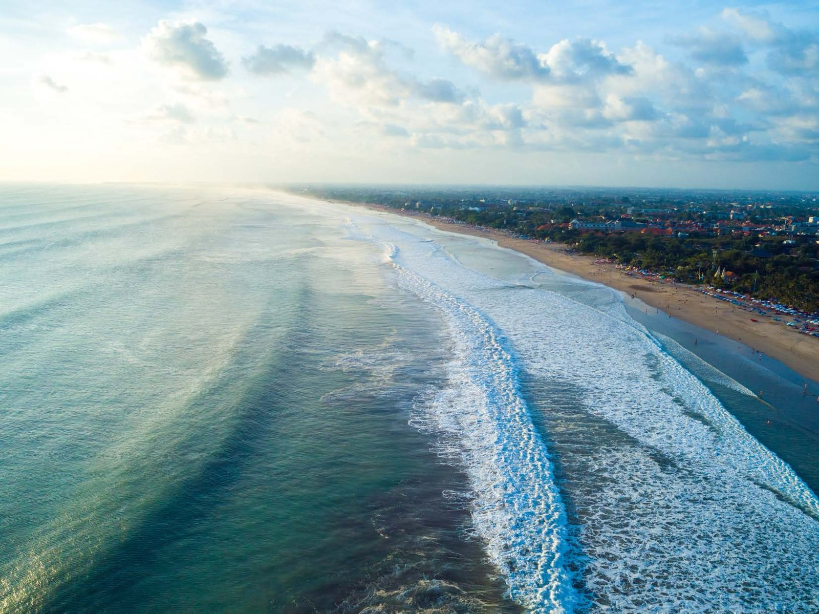 Long beach and shoreline at low sun
