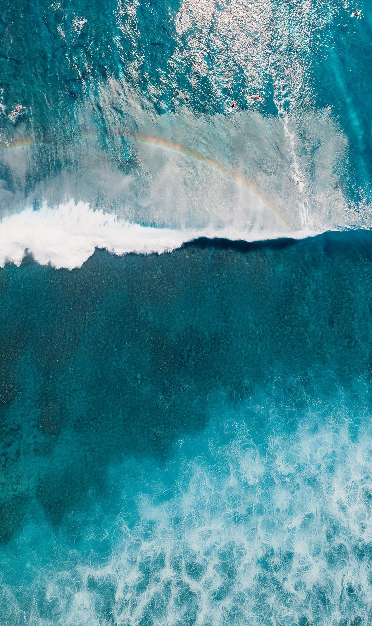 Surf breaking on the west coast, seen from above