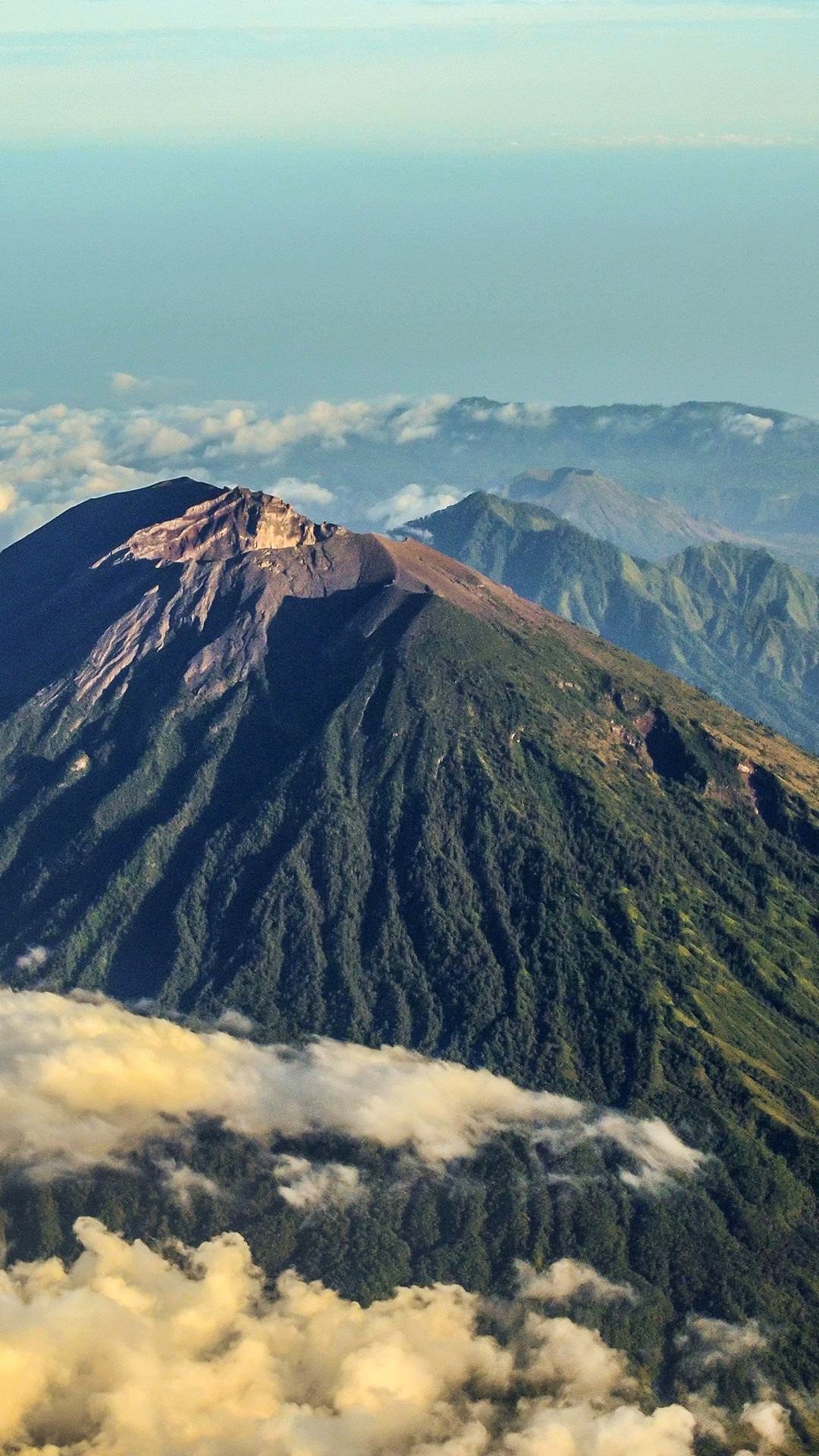 Volcanic ridgeline standing above cloud